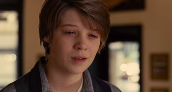 Movie still from “We Bought a Zoo” (2011), directed by Cameron Crowe – A young man with a brown hair and blue eyes; Close Up shot, Over the shoulder angle
