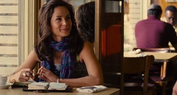Movie still from “We Bought a Zoo” (2011), directed by Cameron Crowe – A woman sitting at a table in front of a window; Close Up shot, Over the shoulder angle