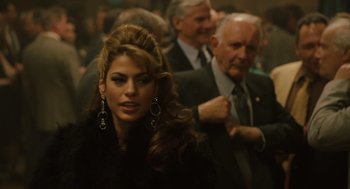 Movie still from “We Own the Night” (2007), directed by James Gray – A woman in a black jacket and a man in a black suit; Close Up shot, Over the shoulder angle