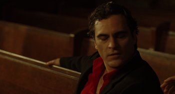 Movie still from “We Own the Night” (2007), directed by James Gray – A man sitting in a chair with his eyes closed; Close Up shot, Low angle