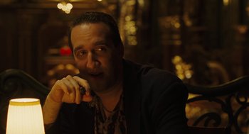 Movie still from “We Own the Night” (2007), directed by James Gray – A person talking on a cell phone; Close Up shot, Low angle