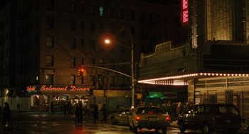 Movie still from “We Own the Night” (2007), directed by James Gray – A street scene with cars parked on the side of the road; Extreme Wide shot, High angle
