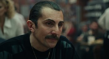 Movie still from “We Own the Night” (2007), directed by James Gray – A person with a mustache; Close Up shot, Low angle