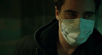 Movie still from “We Own the Night” (2007), directed by James Gray – A person wearing a face mask; Close Up shot, Low angle
