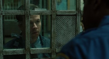 Movie still from “We Own the Night” (2007), directed by James Gray – A man is looking at himself in the mirror; Close Up shot, Over the shoulder angle