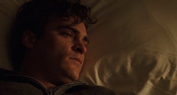 Movie still from “We Own the Night” (2007), directed by James Gray – A person laying in a bed; Close Up shot, High angle