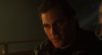 Movie still from “We Own the Night” (2007), directed by James Gray – A person wearing a leather jacket; Close Up shot, Over the shoulder angle