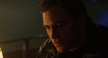 Movie still from “We Own the Night” (2007), directed by James Gray – A person wearing a leather jacket; Close Up shot, Low angle