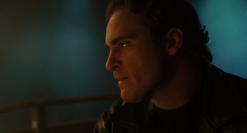Movie still from “We Own the Night” (2007), directed by James Gray – A person looking to his left; Close Up shot, Low angle