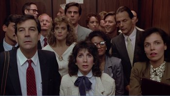 Movie still from “Weekend at Bernie's” (1989), directed by Ted Kotcheff – A group of people standing in front of each other; Medium shot, High angle