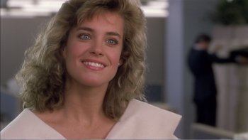 Movie still from “Weekend at Bernie's” (1989), directed by Ted Kotcheff – A person with a smile on their face; Close Up shot, Over the shoulder angle