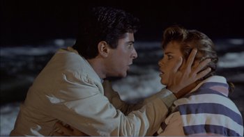 Movie still from “Weekend at Bernie's” (1989), directed by Ted Kotcheff – A man and a woman fighting in the dark; Close Up shot, Over the shoulder angle