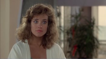 Movie still from “Weekend at Bernie's” (1989), directed by Ted Kotcheff – A person wearing a white shirt; Close Up shot, Over the shoulder angle