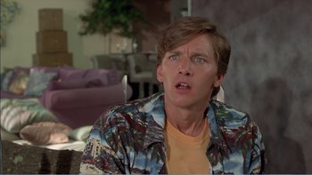 Movie still from “Weekend at Bernie's” (1989), directed by Ted Kotcheff – A man in a hawaiian shirt is looking surprised; Close Up shot, Low angle