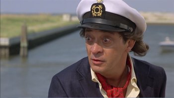 Movie still from “Weekend at Bernie's” (1989), directed by Ted Kotcheff – A man wearing a white hat and a red tie; Close Up shot, Low angle