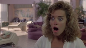 Movie still from “Weekend at Bernie's” (1989), directed by Ted Kotcheff – A woman with a surprised look on her face; Close Up shot, Over the shoulder angle