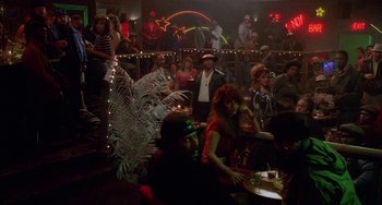 A group of people sitting at tables in a room