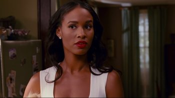 Movie still from “Welcome Home, Roscoe Jenkins” (2008), directed by Malcolm D. Lee – A woman in a white dress is looking at the camera; Close Up shot, Over the shoulder angle