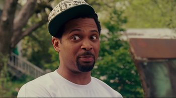 Movie still from “Welcome Home, Roscoe Jenkins” (2008), directed by Malcolm D. Lee – A person wearing a hat; Close Up shot, Over the shoulder angle