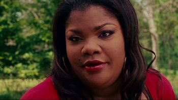 Movie still from “Welcome Home, Roscoe Jenkins” (2008), directed by Malcolm D. Lee – A person wearing a red shirt; Close Up shot, High angle