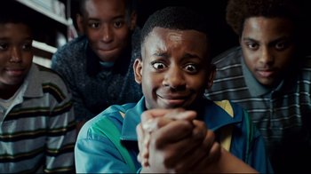 Movie still from “Welcome Home, Roscoe Jenkins” (2008), directed by Malcolm D. Lee – A group of young boys sitting next to each other; Close Up shot, Low angle