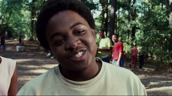 Movie still from “Welcome Home, Roscoe Jenkins” (2008), directed by Malcolm D. Lee – A person with a group of people in the background; Close Up shot, Low angle