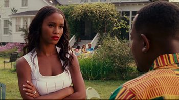 Movie still from “Welcome Home, Roscoe Jenkins” (2008), directed by Malcolm D. Lee – A woman standing next to another woman in a yard; Close Up shot, Over the shoulder angle