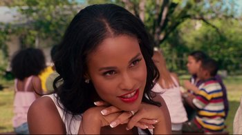 Movie still from “Welcome Home, Roscoe Jenkins” (2008), directed by Malcolm D. Lee – A woman with red lipstick posing for a picture; Close Up shot, Over the shoulder angle