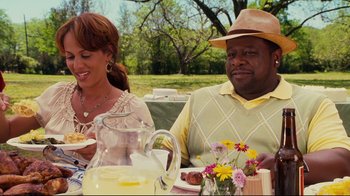 Movie still from “Welcome Home, Roscoe Jenkins” (2008), directed by Malcolm D. Lee – A man and a woman sitting at a table; Medium shot, Over the shoulder angle
