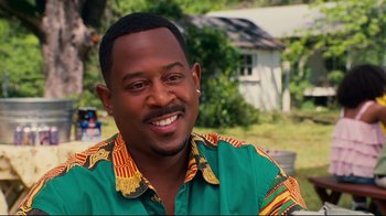 Movie still from “Welcome Home, Roscoe Jenkins” (2008), directed by Malcolm D. Lee – A person wearing a green shirt; Close Up shot, Over the shoulder angle