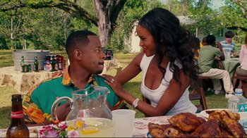 Movie still from “Welcome Home, Roscoe Jenkins” (2008), directed by Malcolm D. Lee – A man and a woman sitting at an outdoor table; Medium shot, Over the shoulder angle