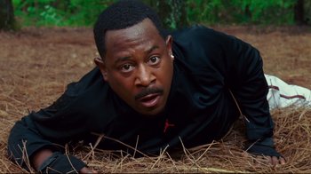 Movie still from “Welcome Home, Roscoe Jenkins” (2008), directed by Malcolm D. Lee – A man laying on the ground in the dirt; Close Up shot, High angle