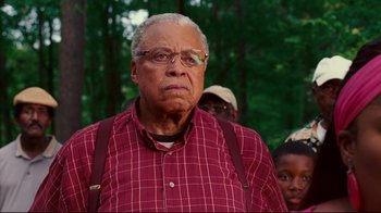 Movie still from “Welcome Home, Roscoe Jenkins” (2008), directed by Malcolm D. Lee – An older man wearing glasses and a plaid shirt; Close Up shot, Low angle
