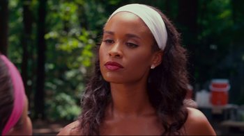 Movie still from “Welcome Home, Roscoe Jenkins” (2008), directed by Malcolm D. Lee – A woman wearing a white head band looking to her left; Close Up shot, Over the shoulder angle