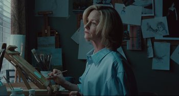 Movie still from “Welcome to the Rileys” (2010), directed by Jake Scott – A woman is holding a paintbrush in her hand; Medium shot, Low angle