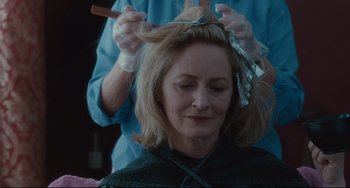 Movie still from “Welcome to the Rileys” (2010), directed by Jake Scott – A woman getting her hair cut by a stylist; Close Up shot, Over the shoulder angle