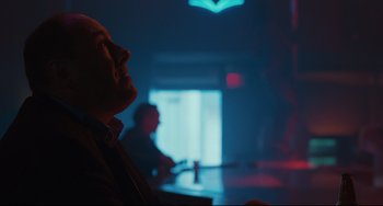 Movie still from “Welcome to the Rileys” (2010), directed by Jake Scott – A man sitting at a table in front of a window; Close Up shot, Low angle