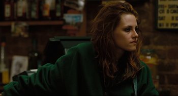 Movie still from “Welcome to the Rileys” (2010), directed by Jake Scott – A woman in a green jacket looking to her left; Close Up shot, Over the shoulder angle