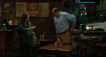 Movie still from “Welcome to the Rileys” (2010), directed by Jake Scott – A man and a woman standing at a table in a restaurant; Medium shot, Over the shoulder angle