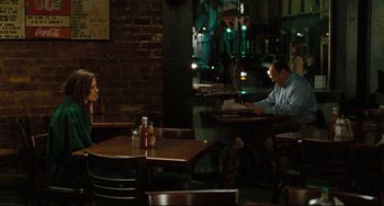 Movie still from “Welcome to the Rileys” (2010), directed by Jake Scott – A man and woman sitting at a table in a restaurant; Medium shot, Over the shoulder angle
