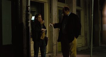 Movie still from “Welcome to the Rileys” (2010), directed by Jake Scott – A man and a woman standing on a sidewalk; Medium shot, Over the shoulder angle