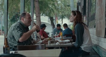 Movie still from “Welcome to the Rileys” (2010), directed by Jake Scott – A man and a woman are sitting at a table; Medium shot, Over the shoulder angle
