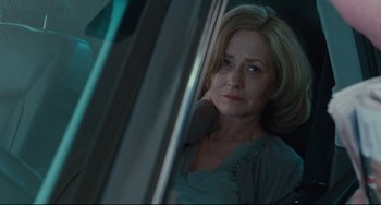 Movie still from “Welcome to the Rileys” (2010), directed by Jake Scott – A woman sitting in a car looking out the window; Close Up shot, Low angle