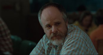 Movie still from “Welcome to the Rileys” (2010), directed by Jake Scott – A person with a beard; Close Up shot, Over the shoulder angle
