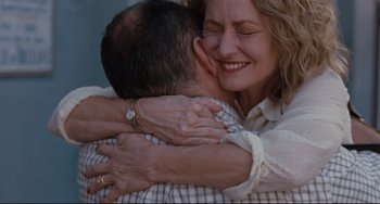 Movie still from “Welcome to the Rileys” (2010), directed by Jake Scott – Two people hugging each other and smiling for the camera; Close Up shot, Over the shoulder angle
