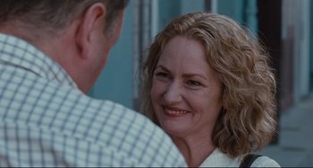 Movie still from “Welcome to the Rileys” (2010), directed by Jake Scott – A person with a smile on their face; Close Up shot, Over the shoulder angle