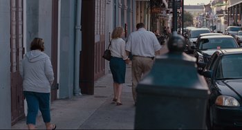 Movie still from “Welcome to the Rileys” (2010), directed by Jake Scott – A man and a woman walking down the sidewalk; Wide shot, Over the shoulder angle