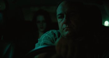 Movie still from “Welcome to the Rileys” (2010), directed by Jake Scott – A man and a woman in a dark room; Close Up shot, Over the shoulder angle