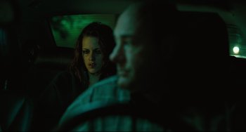 Movie still from “Welcome to the Rileys” (2010), directed by Jake Scott – A woman sitting in a car next to a man in a car; Medium shot, Over the shoulder angle