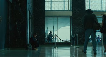 Movie still from “Welcome to the Rileys” (2010), directed by Jake Scott – A man sitting on the ground in a building; Wide shot, Low angle